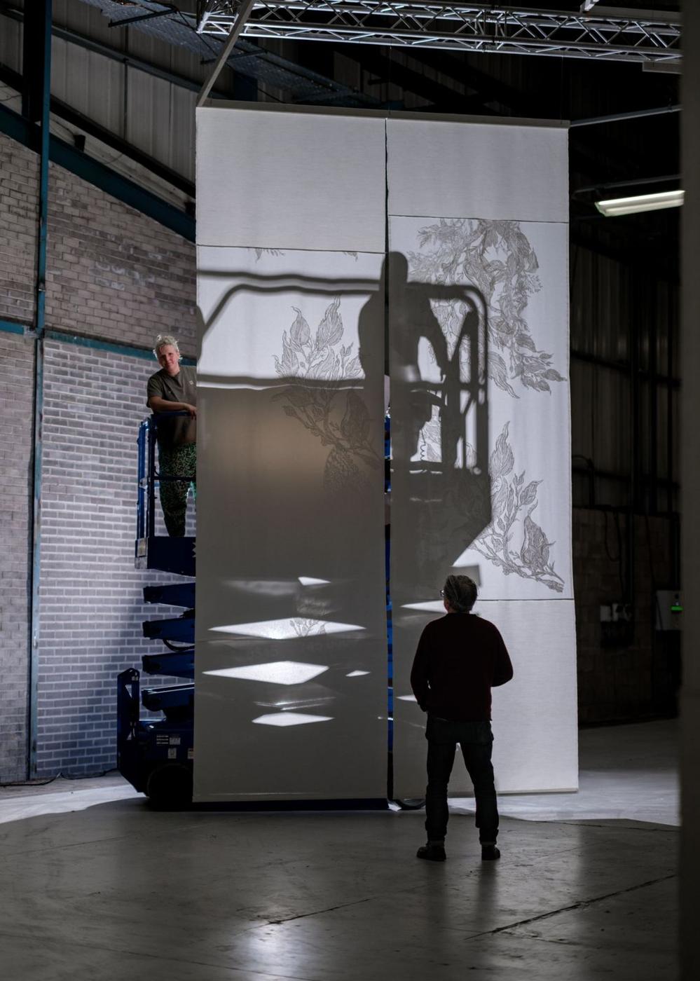 Exhibition panel being installed