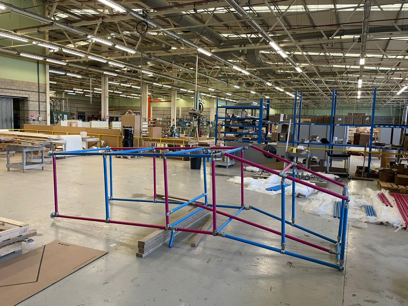 Tubular structure being built in a warehouse